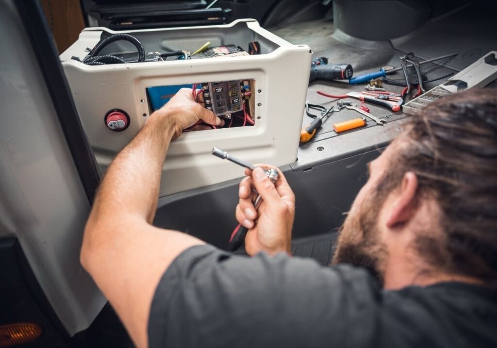 Technician arriving in mobile repair van at Lake Mead campsite