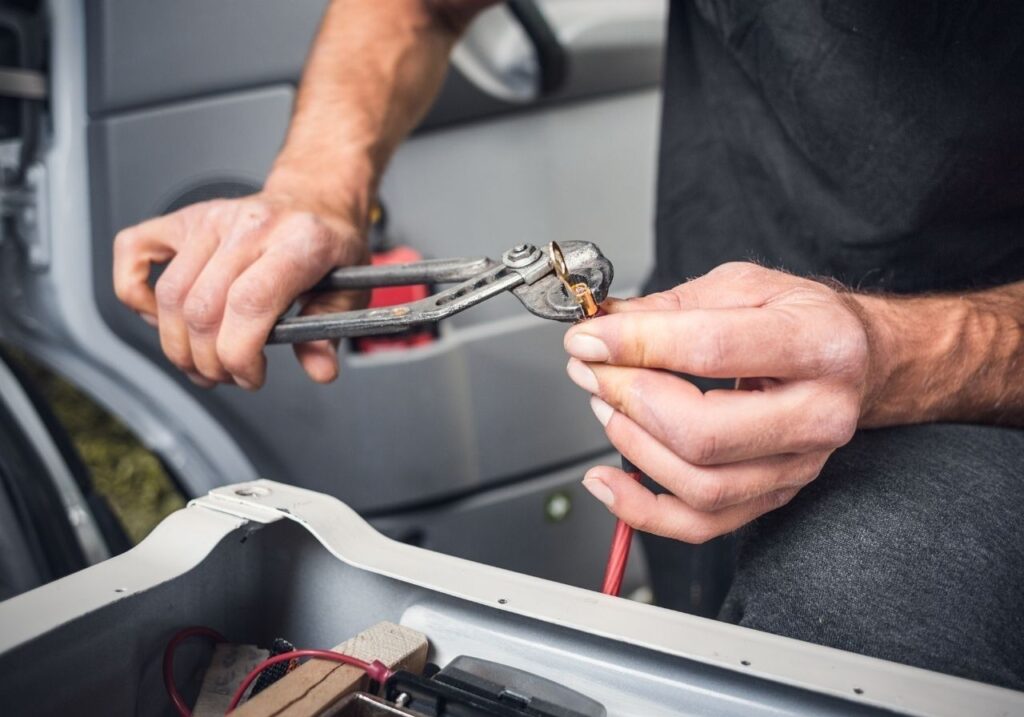 Technician showing repair estimate on tablet to RV customer